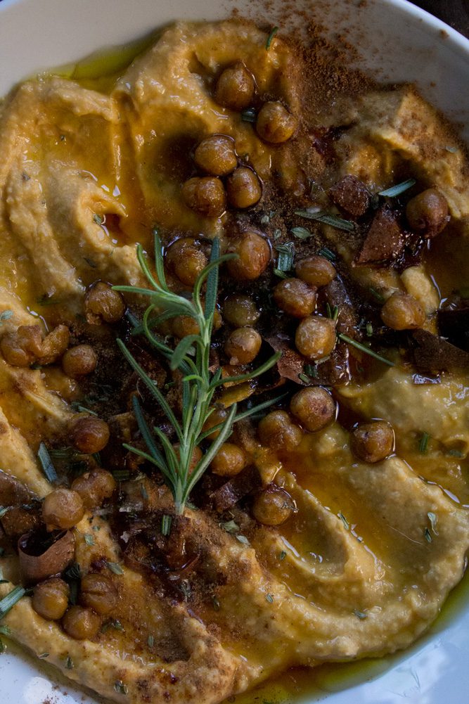 Roasted Sweet Potato hummus with crispy chickpeas, maple syrup, olive oil, cinnamon, and fresh thyme and rosemary