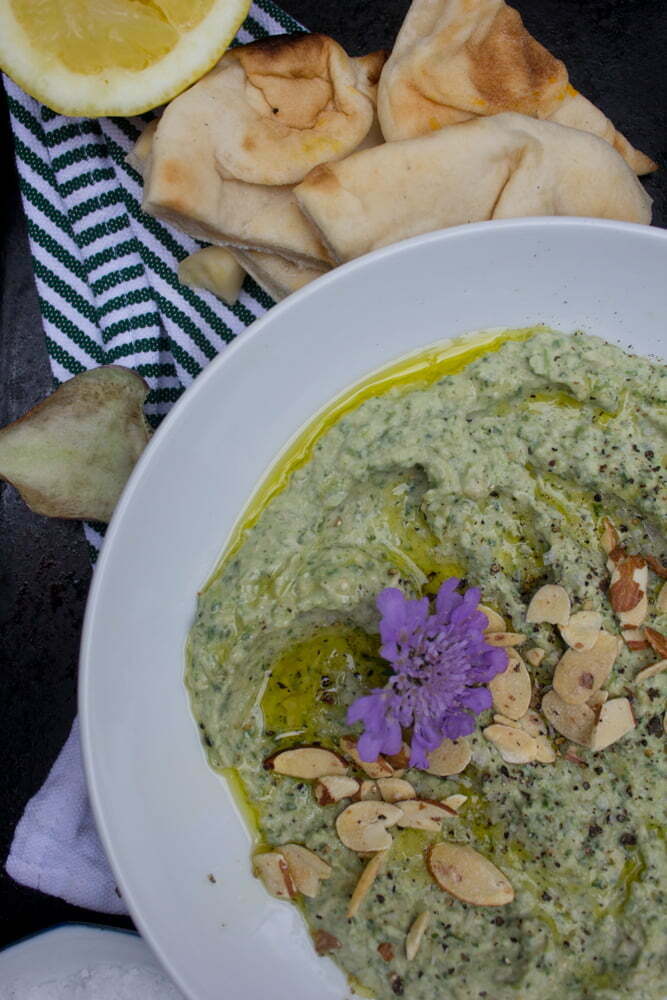 Closeup of spinach artichoke hummus | Enjoy with flatbreads, radishes, carrots, or steamed artichokes