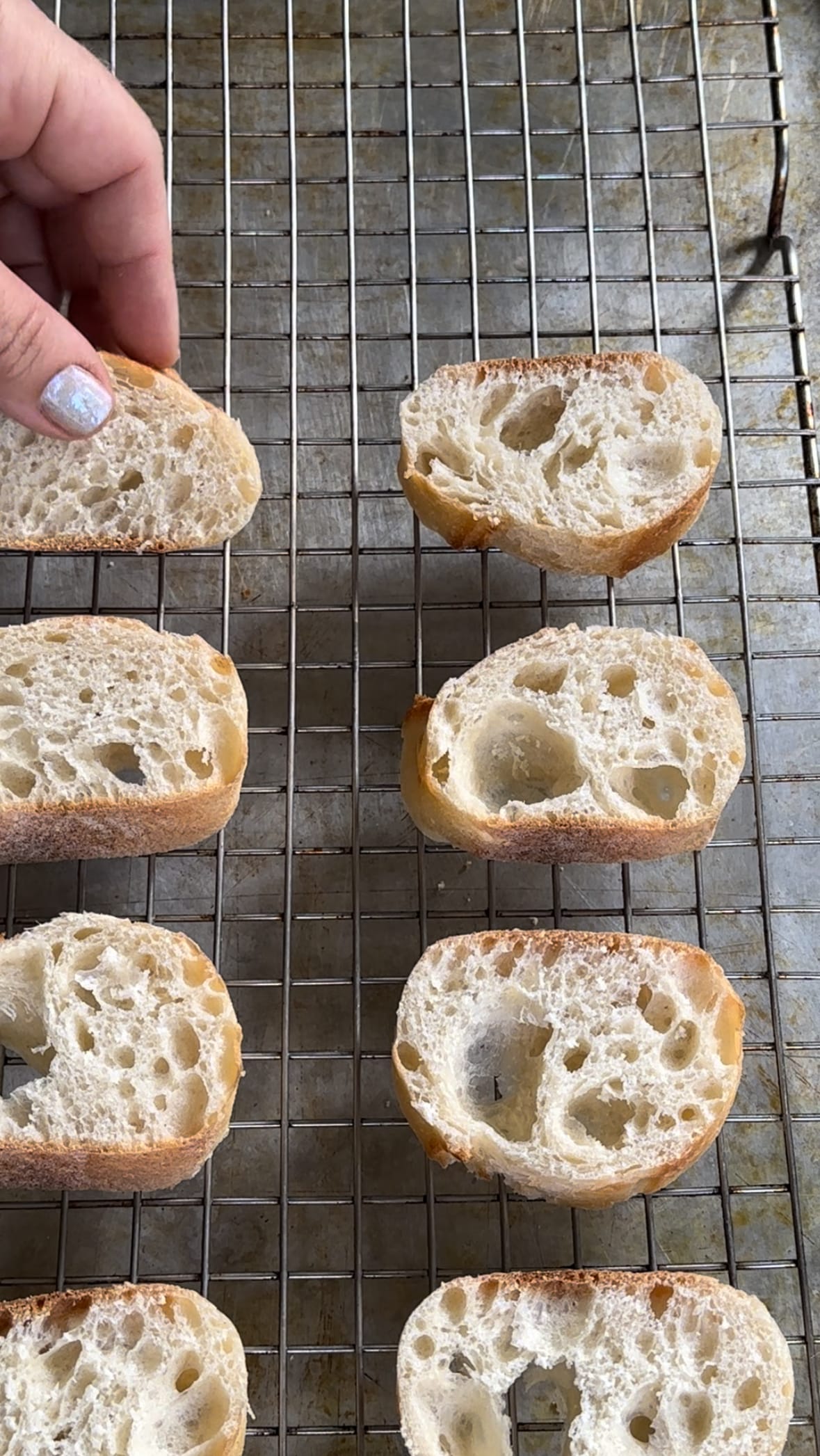 Untoasted French baguette placed on a baking sheet