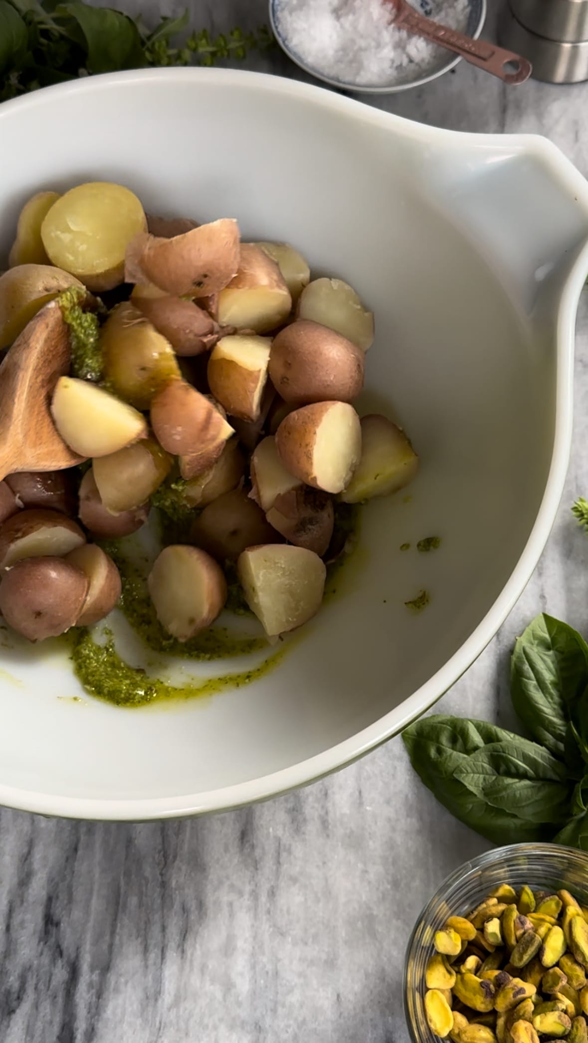 Tossing boiled red and yukon gold potatoes for Pesto Potato Salad